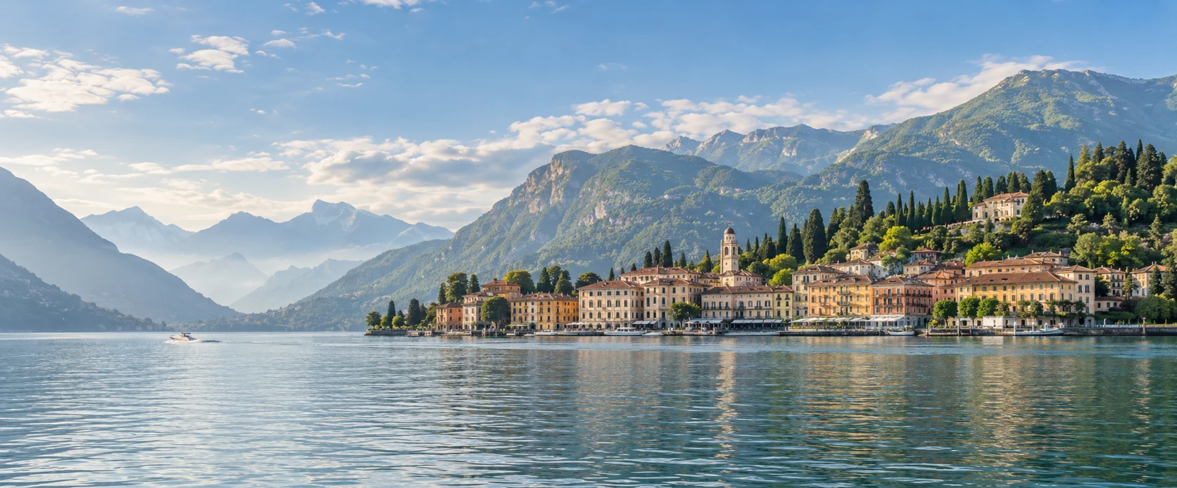 Lake Como waterfront beneath wooded mountains in soft morning light